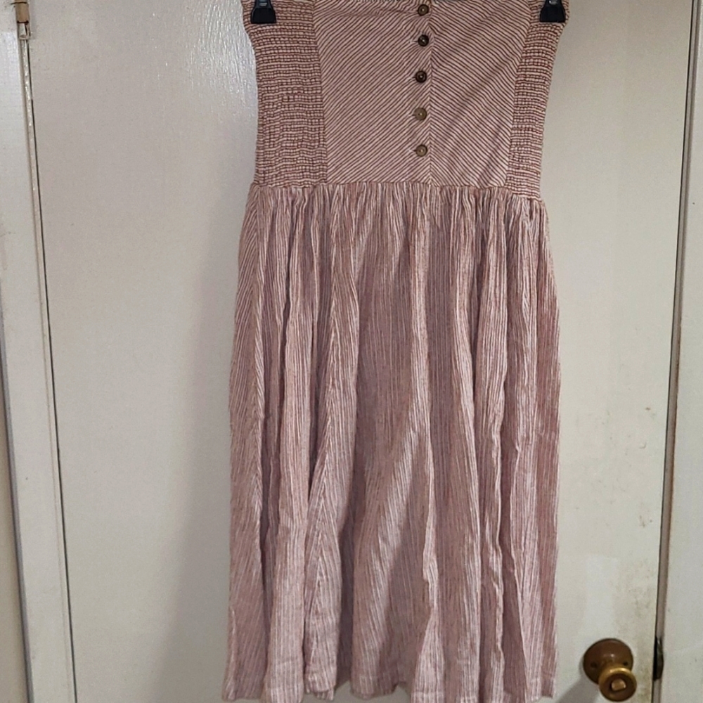 Free People shirred and strapless dress. Button front bodice.
